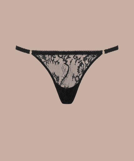 Maison Close/Scandale – Inspiration Divine Cross Micro Thong Black Inspiration Divine black Cross Micro Thong with a sheer floral lace front and narrow side straps, front view on model.