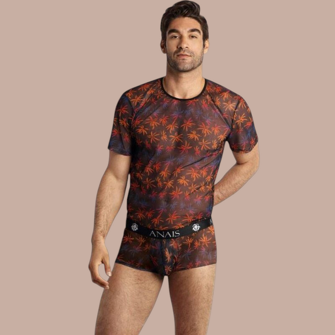 Pleasurements Anais Men Chill T-shirt met transparante stof en kleurrijk palmbladpatroon gedragen door een model