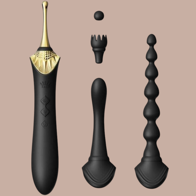 Pleasurements Zalo Bess 2 zwarte siliconen clitorismassager met verwisselbare opzetstukken en gouden accenten.