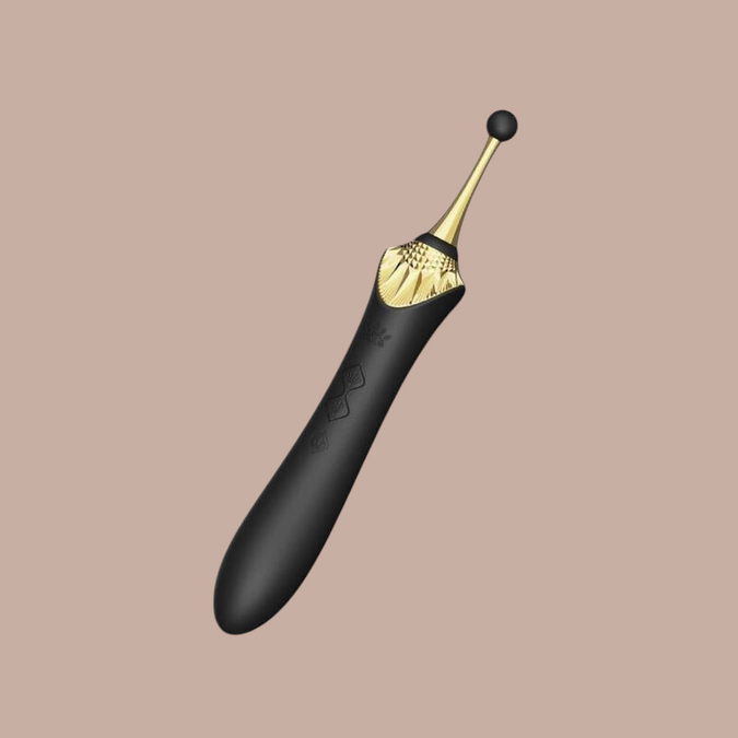 Pleasurements Zalo Bess 2 clitorale massager in zwart silicone met gouden accenten en verwisselbare opzetstukken