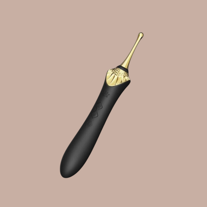 Pleasurements Zalo Bess 2 clitorale massager in zwart silicone met gouden accenten en verwisselbare opzetstukken