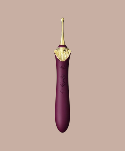 Zalo – Bess 2 Clitorismassager Paars Pleasurements Zalo Bess 2 paarse clitorisstimulator van siliconen met verwisselbare opzetstukken en gouden details.