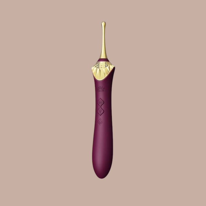 Pleasurements Zalo Bess 2 clitorisstimulator in paars siliconen met gouden accenten en verwarmingsfunctie