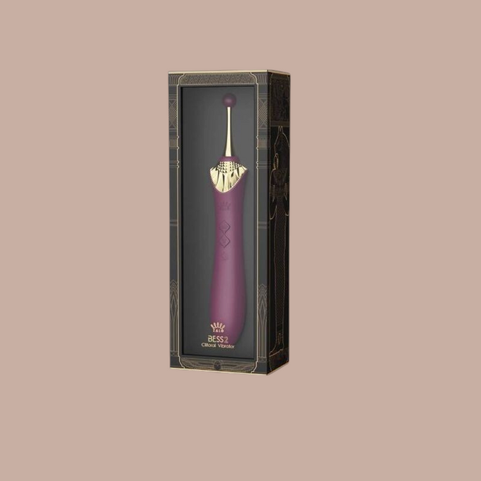 Pleasurements Zalo Bess 2 paarse clitoris vibrator van siliconen met gouden details in luxe verpakking