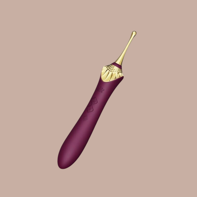 Pleasurements Zalo Bess 2 clitorale massager in paars siliconen met gouden accenten en verwarmingsfunctie