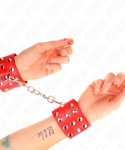 KINK - WRIST RESTRAINTS WITH SNAP FASTEN FULL OF RIVETS RED ADJUSTABLE 19-24 CM X 5.5 CM KINK - WRIST RESTRAINTS WITH SNAP FASTEN FULL OF RIVETS RED ADJUSTABLE 19-24 CM X 5.5 CM