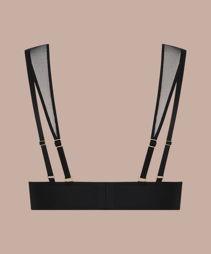 Pleasurements Scandale Nuit Fauve zwarte cupless bh met transparante tule details gedragen door een model
