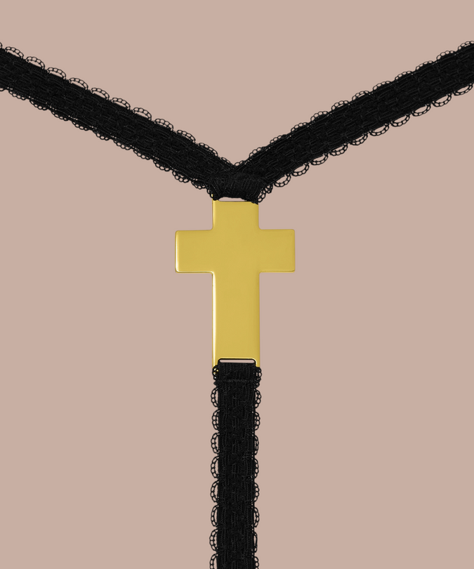 Inspiration Divine black Cross Micro Thong, close-up of the gold-tone cross detail.