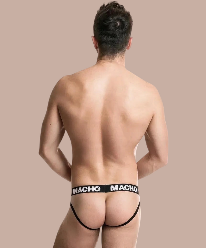 Pleasurements Macho MX26X2 jockstrap in zwart en rood met elastische tailleband op een man van achteren gezien.
