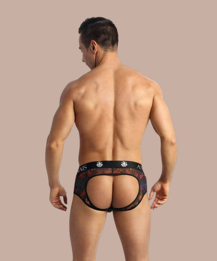 Pleasurements Anais Men Chill Jock Bikini met palmboomprint en zwarte tailleband gedragen door een lachend model