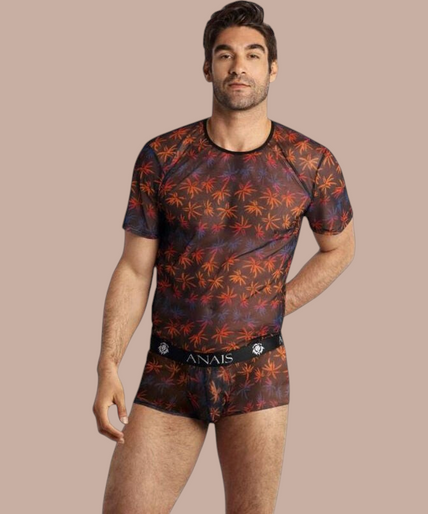 Pleasurements Anais Men Chill T-shirt met transparante stof en kleurrijk palmbladpatroon gedragen door een model