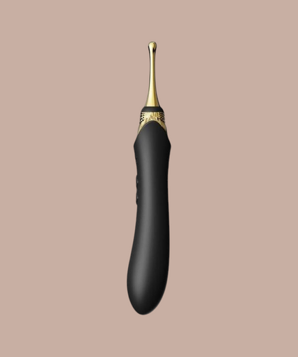 Pleasurements Zalo Bess 2 zwarte siliconen clitorismassager met verwisselbare opzetstukken en gouden accenten.