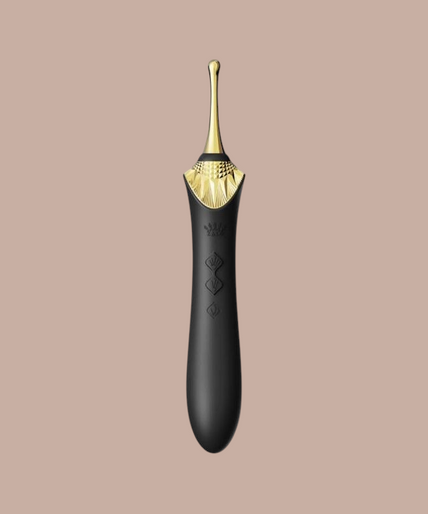 Pleasurements Zalo Bess 2 zwarte siliconen clitorismassager met verwisselbare opzetstukken en gouden accenten.