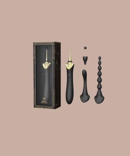 Pleasurements Zalo Bess 2 zwarte siliconen clitorismassager met verwisselbare opzetstukken en gouden accenten.