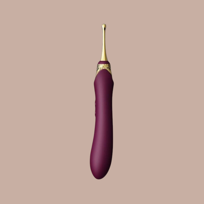 Pleasurements Zalo Bess 2 clitorale massager in paars siliconen met gouden accenten en verwarmingsfunctie