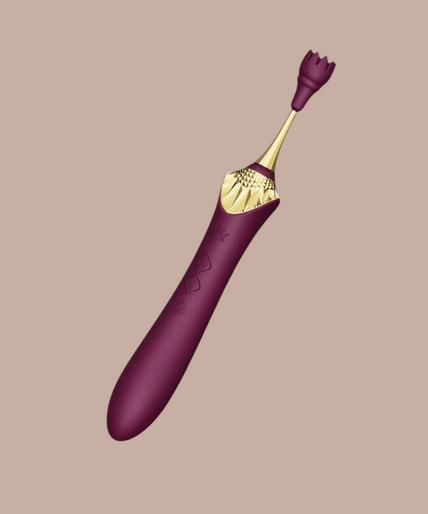 Pleasurements Zalo Bess 2 paarse clitorisstimulator van siliconen met verwisselbare opzetstukken en gouden details.